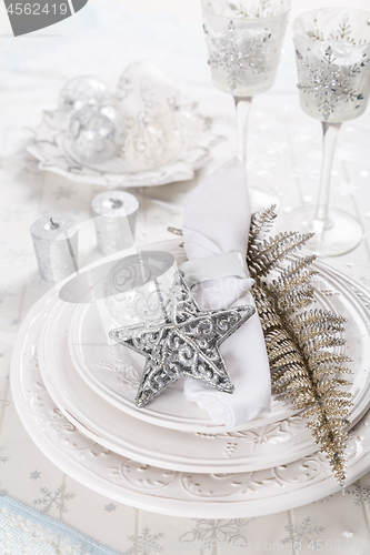 Image of Festive table setting with silver star on plate