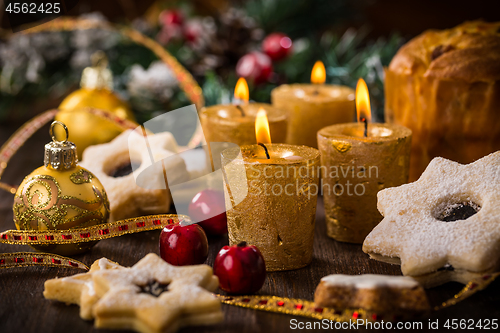 Image of Christmas still life with homemade cookies and candles