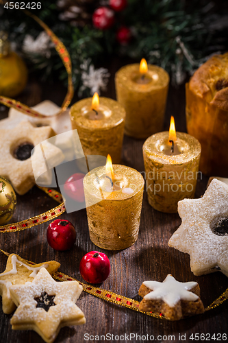 Image of Christmas still life with homemade cookies and candles