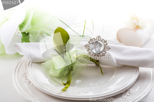 Image of Festive table setting with bouquet on plate