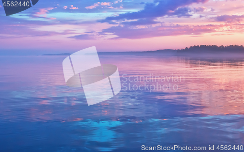 Image of Misty Lilac Sunset Seascape With Sky Reflection