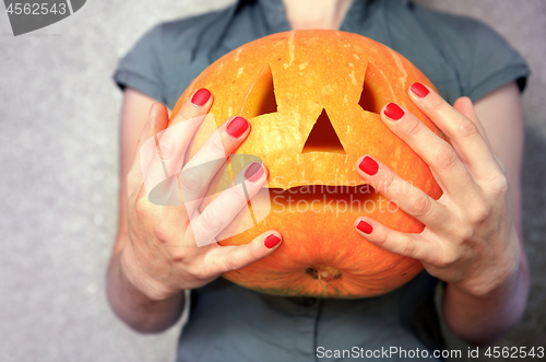 Image of Pumpkin for Halloween in hands