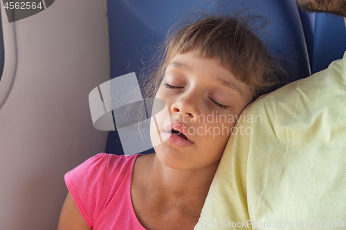 Image of Girl sleeping leaning on her neighbor\'s shoulder