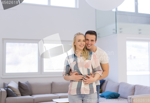 Image of couple hugging in their new home