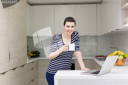 Image of woman drinking coffee enjoying relaxing lifestyle