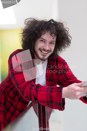 Image of young freelancer using tablet computer