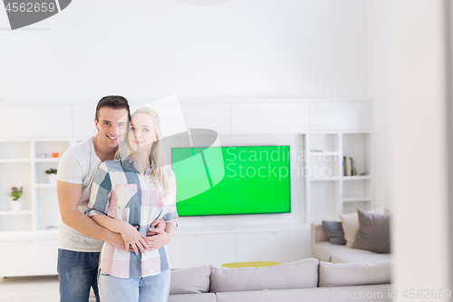 Image of couple hugging in their new home