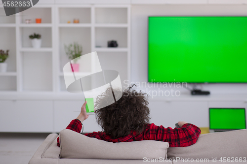 Image of young man in bathrobe enjoying free time