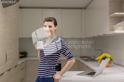 Image of woman drinking coffee enjoying relaxing lifestyle