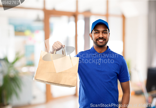 Image of delivery man with food in paper bag at office