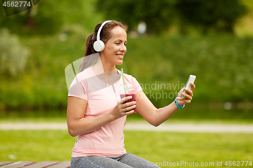 Image of woman with smartphone and shake listening to music