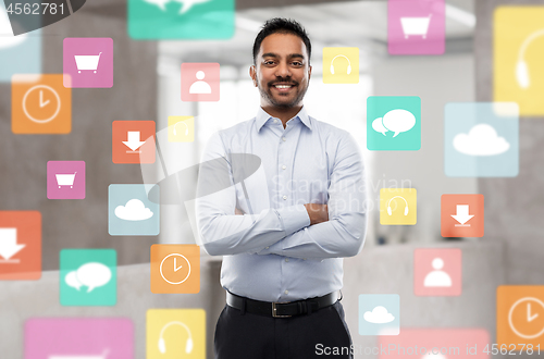 Image of indian businessman with app icons at office