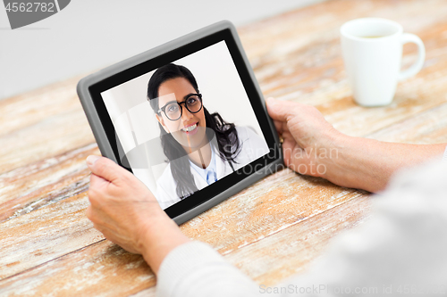 Image of senior woman patient having video call with doctor