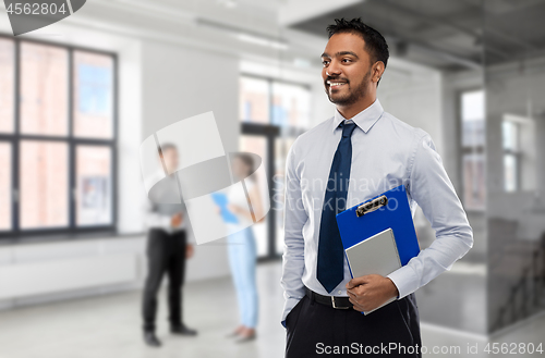 Image of indian businessman or realtor in empty office room