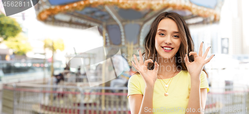 Image of young woman or teenage girl ok hand sign