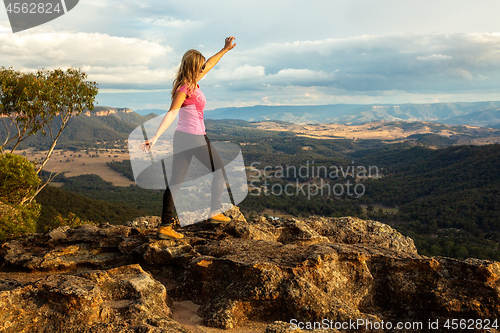 Image of Bushwalker on rocky outcrop