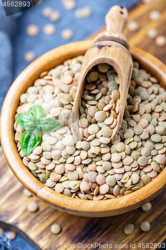 Image of Brown organic dried lentils close up.