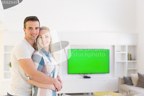 Image of couple hugging in their new home