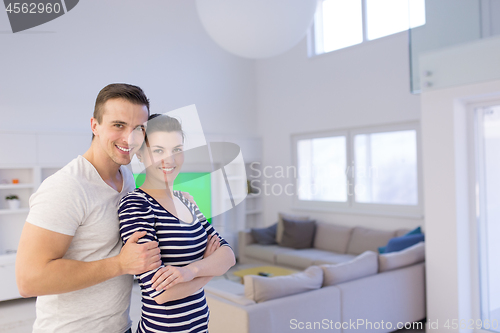Image of couple hugging in their new home
