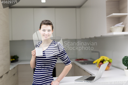 Image of woman drinking coffee enjoying relaxing lifestyle