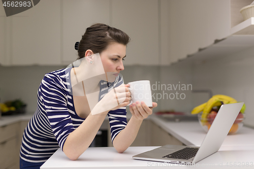 Image of woman drinking coffee enjoying relaxing lifestyle