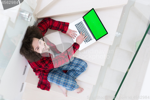 Image of freelancer in bathrobe working from home