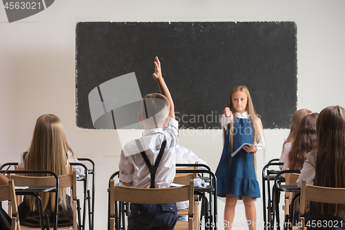 Image of School children in classroom at lesson