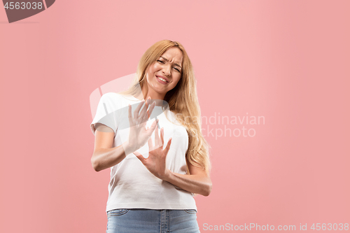 Image of Let me think. Doubtful pensive woman with thoughtful expression making choice against pink background