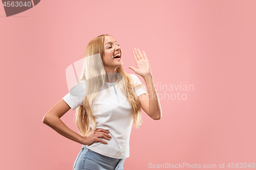 Image of Isolated on pink young casual woman shouting at studio