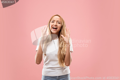 Image of Isolated on pink young casual woman shouting at studio