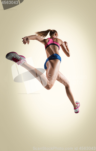 Image of The studio shot of high jump female athlete is in action