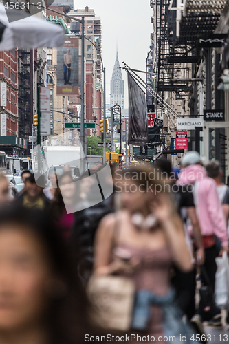 Image of New York, NY, USA - May 17, 2018: Crowds of people walking sidewalk of Broadway avenue in Soho of Midtown Manhattan on may 17th, 2018 in New York City, USA.