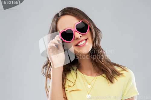 Image of teenage girl in heart-shaped sunglasses