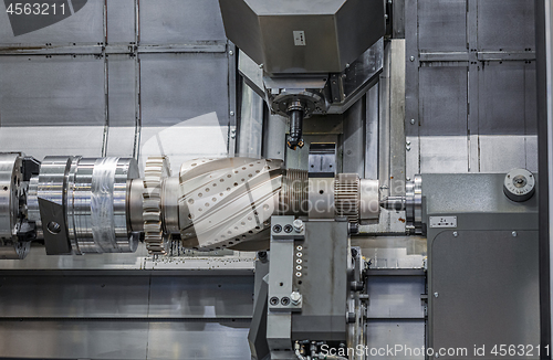 Image of Metalworking CNC lathe milling machine. Cutting metal modern pro