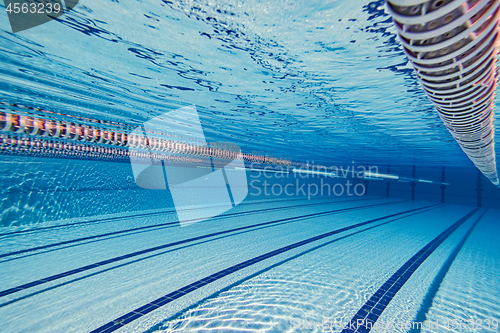 Image of Olympic Swimming pool under water background.