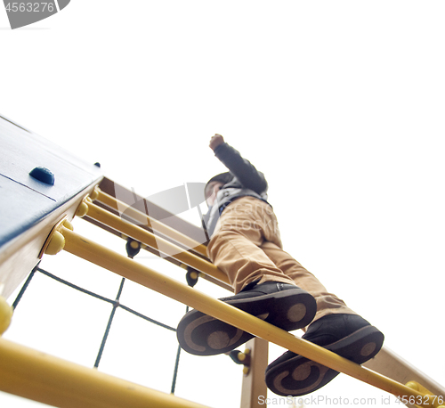 Image of Boy climbs to the top