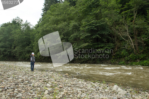 Image of Boy have fun near the river