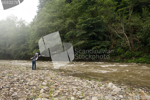 Image of Boy have fun near the river