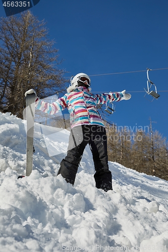 Image of Skier enjoying sunny weather