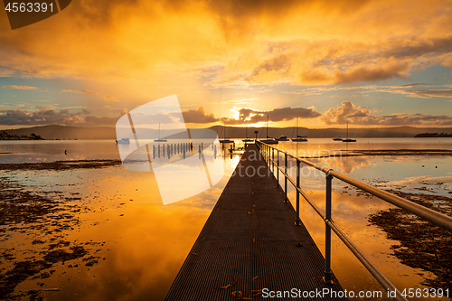 Image of Sunset skies and water reflections from the jetty