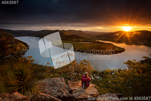 Image of Watching beautiful sunsets over the mountains brings peace to sou