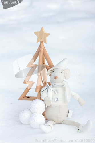 Image of Christmas tree and decorations in the snow