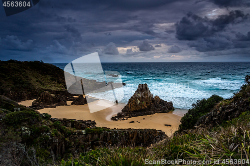 Image of Stormy skies over coastal landscape with impressive sea stacks