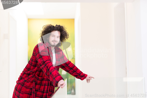 Image of portrait of young man in bathrobe