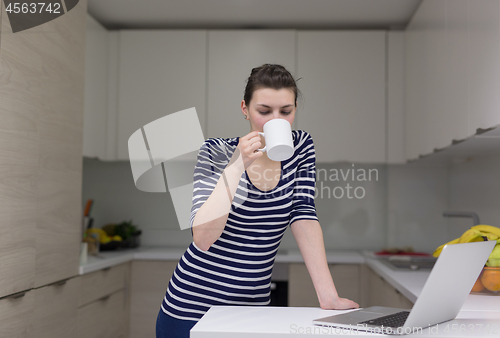 Image of woman drinking coffee enjoying relaxing lifestyle