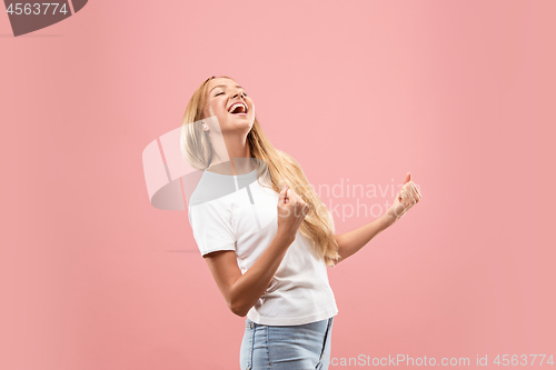 Image of Winning success woman happy ecstatic celebrating being a winner. Dynamic energetic image of female model