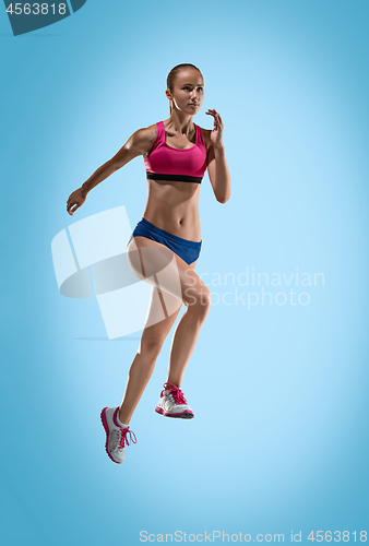 Image of The studio shot of high jump female athlete is in action