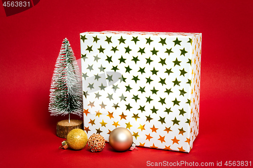 Image of Christmas decoration gift box with red background