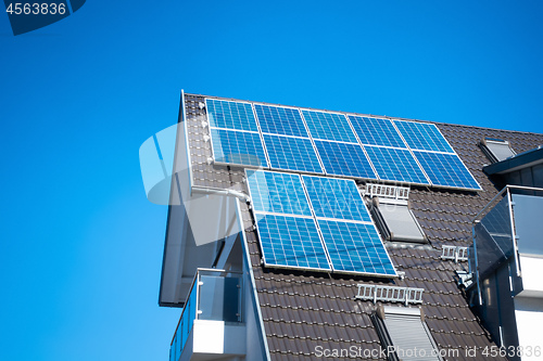 Image of some solar panels on the roof of a private house