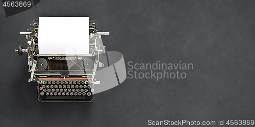 Image of Vintage typewriter with blank sheet of paper retro technology